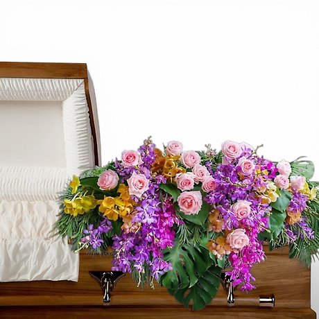 Glamorous rose and orchid casket spray