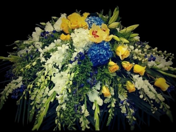 Blues and yellows casket spray